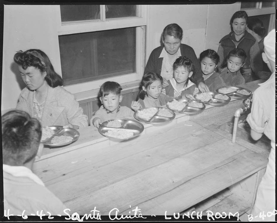 Arcadia, California. Meal time, cafeteria-style, for these children at Santa Anita assembly center for evacuees of Japanese ancestry. Courtesy of the National Archives and Records Administration. 1942
